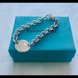 Return to Tiffany sterling silver charm bracelet.